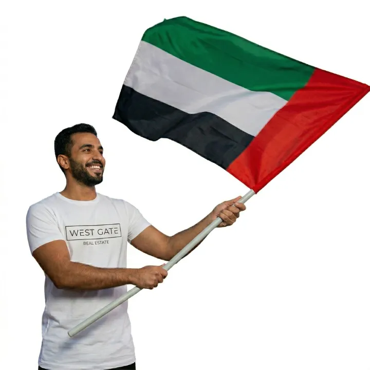 Man Holding the UAE flag high