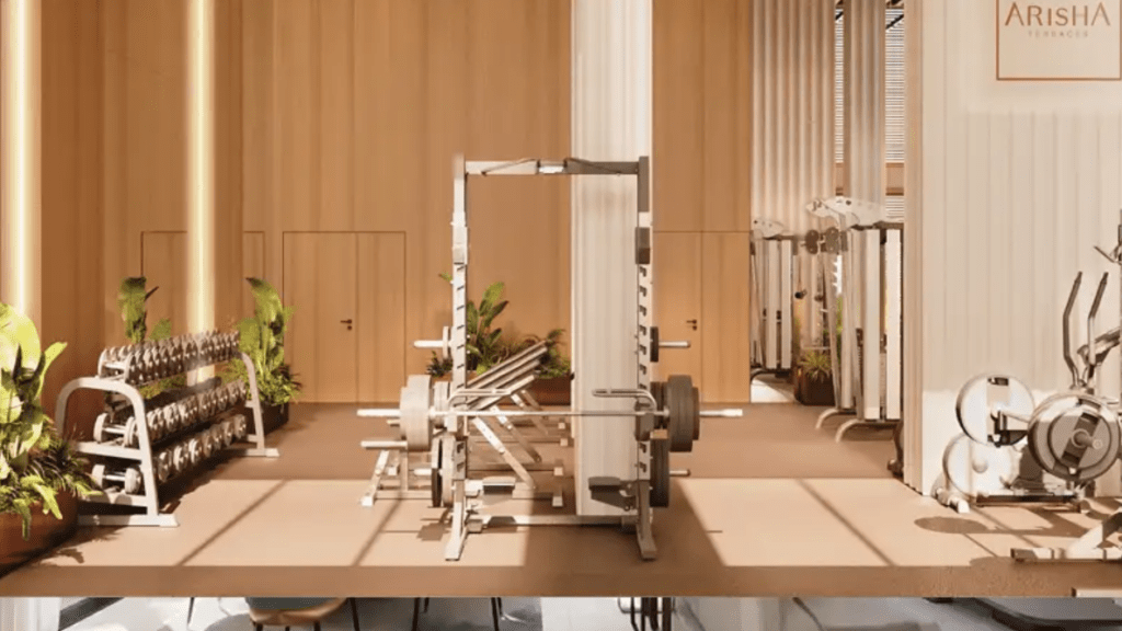 Fully equipped modern gym in Arisha Terraces residential project in Dubai Studio City by Qube Development – smart apartments with modern amenities